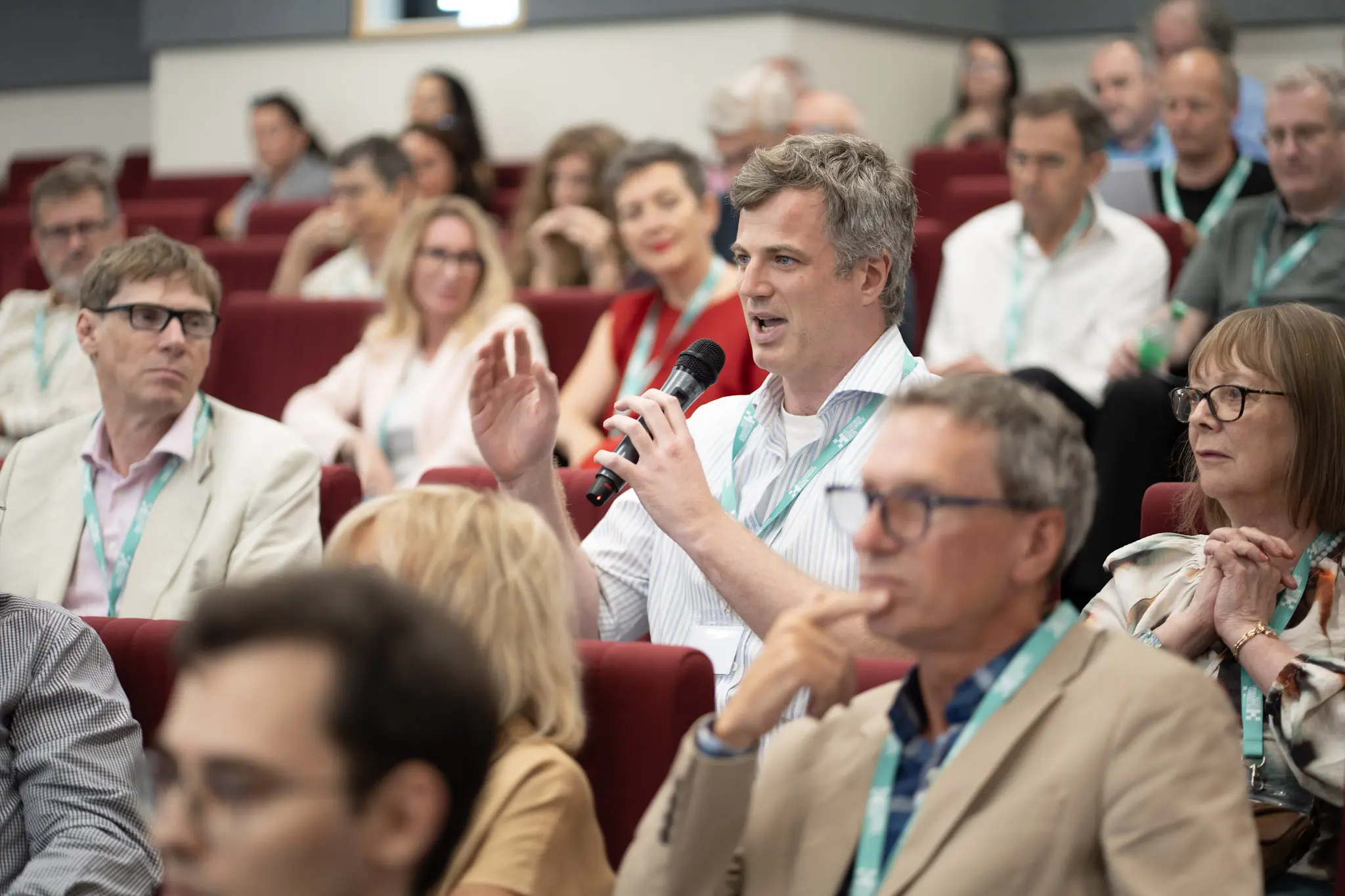 A delegate putting a question to the panel from the floor at the Heterodox Conference