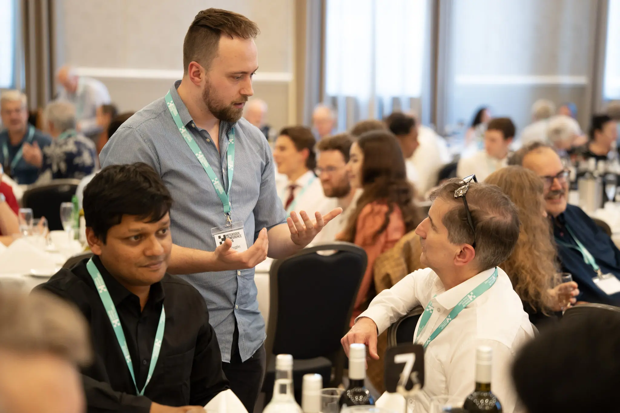 Two delegates in discussion during a break between conference sessions